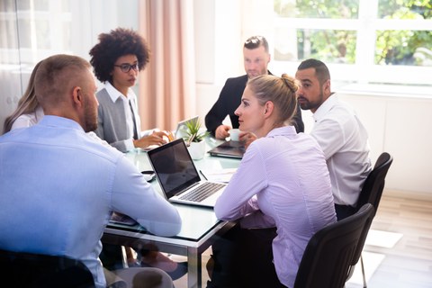 Discussing business team sitting at a table 